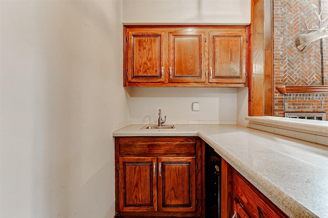 6225 Morton Rd, Katy, TX 77493 - kitchen with a sink, light countertops, and brown cabinetry