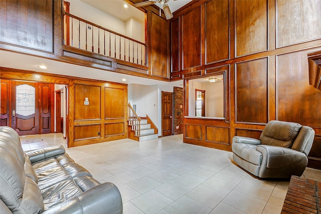 6225 Morton Rd, Katy, TX 77493 - living room featuring a towering ceiling, light tile patterned floors, stairway, recessed lighting, and ceiling fan