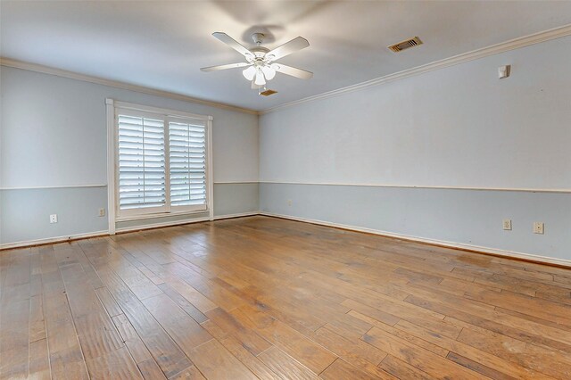 6225 Morton Rd, Katy, TX 77493 - empty room featuring a ceiling fan, wood-type flooring, crown molding, and baseboards