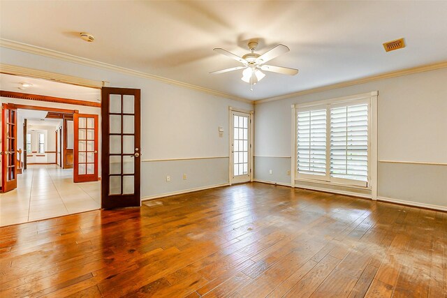 6225 Morton Rd, Katy, TX 77493 - empty room featuring french doors, a ceiling fan, baseboards, hardwood / wood-style flooring, and crown molding