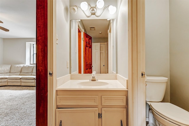 6225 Morton Rd, Katy, TX 77493 - half bath with toilet, vanity, connected bathroom, and ceiling fan