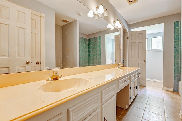 6225 Morton Rd, Katy, TX 77493 - full bath with double vanity, tile patterned floors, and baseboards