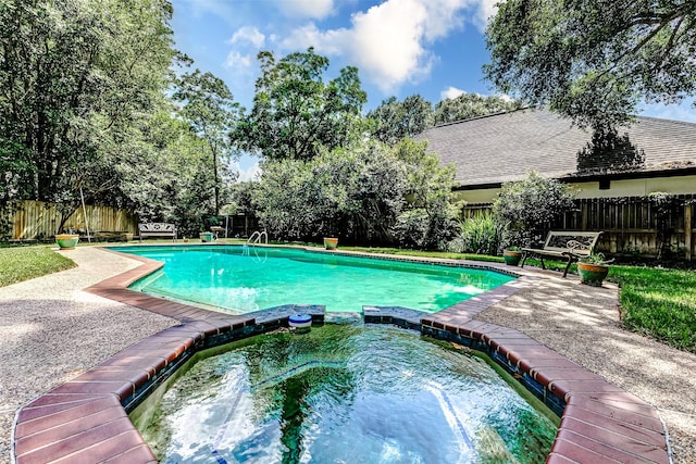 6225 Morton Rd, Katy, TX 77493 - view of pool with a fenced backyard and a pool with connected hot tub