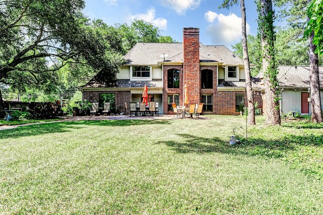 6225 Morton Rd, Katy, TX 77493 - rear view of house featuring brick siding, a chimney, and a patio area