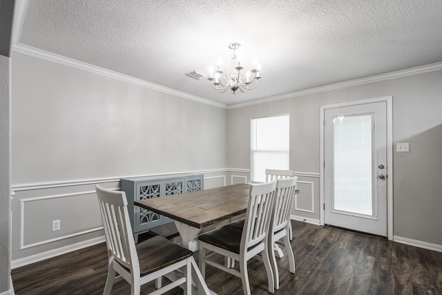 17307 Morning Star Ave, Crosby, TX 77532 - dining area featuring a chandelier, a textured ceiling, wood finished floors, crown molding, and baseboards