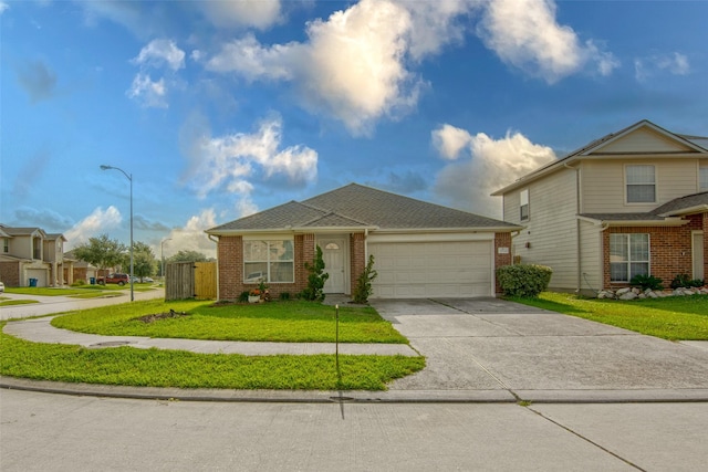 21734 Oriole Trl, Humble, TX 77338 - view of front of home with an attached garage, brick siding, and driveway