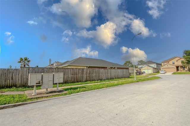 21734 Oriole Trl, Humble, TX 77338 - view of concrete road featuring street lights, sidewalks, curbs, and a residential view