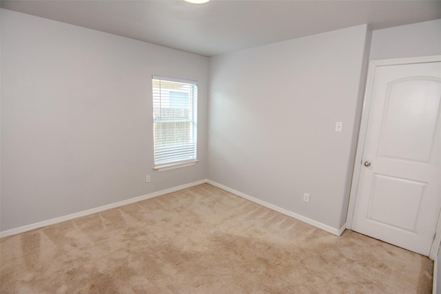 21734 Oriole Trl, Humble, TX 77338 - unfurnished room featuring light carpet and baseboards