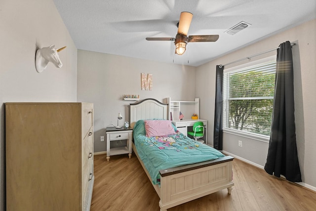 6219 Royal Hollow Ln, Katy, TX 77450 - bedroom featuring wood finished floors, baseboards, and ceiling fan