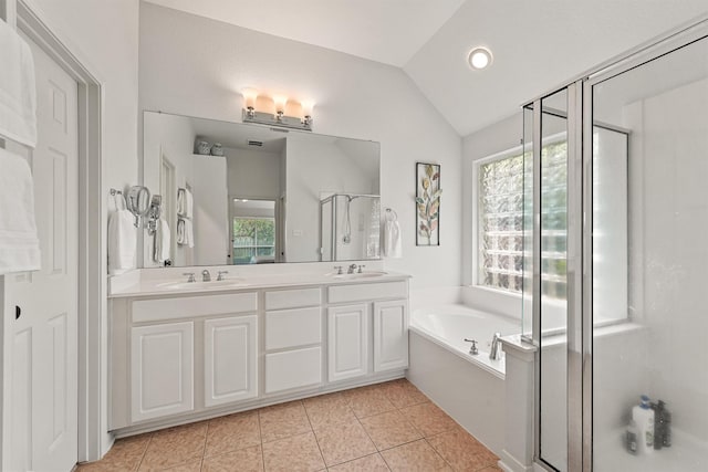 6219 Royal Hollow Ln, Katy, TX 77450 - bathroom with a stall shower, a bath, lofted ceiling, double vanity, and tile patterned flooring