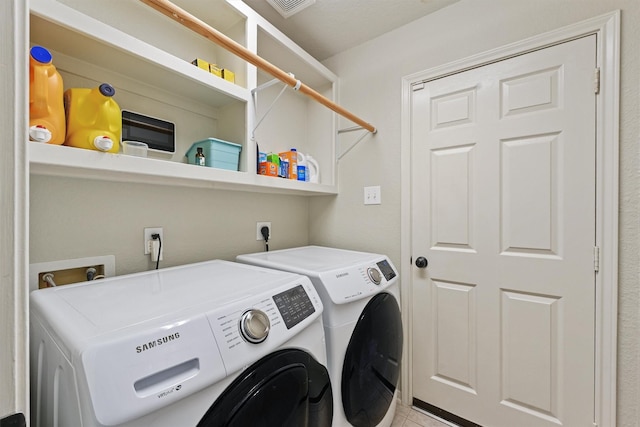 6219 Royal Hollow Ln, Katy, TX 77450 - laundry room featuring washer and dryer and tile patterned floors
