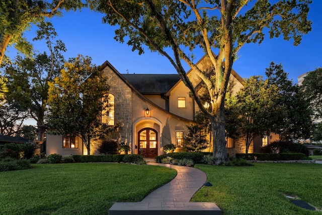 5626 Willers Way, Houston, TX 77056 - view of front facade with french doors, stone siding, stucco siding, and a front yard