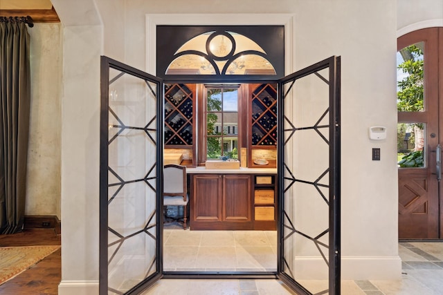 5626 Willers Way, Houston, TX 77056 - wine cellar with baseboards, french doors, and arched walkways
