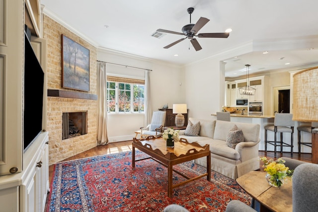 5626 Willers Way, Houston, TX 77056 - living area with wood finished floors, crown molding, ceiling fan, a brick fireplace, and recessed lighting