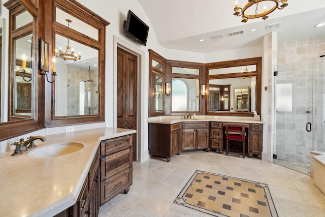 5626 Willers Way, Houston, TX 77056 - full bath with a chandelier, a shower stall, two vanities, and recessed lighting