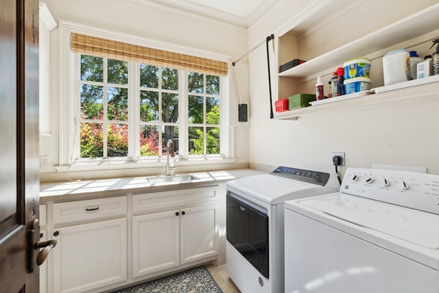 5626 Willers Way, Houston, TX 77056 - laundry room featuring cabinet space, independent washer and dryer, plenty of natural light, and crown molding