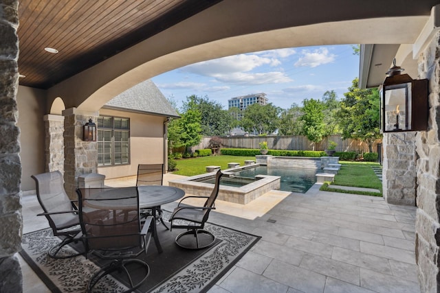 5626 Willers Way, Houston, TX 77056 - view of patio / terrace with an in-ground hot tub and outdoor dining space