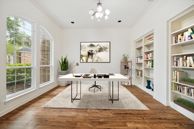 12210 Pebble Mdws, Houston, TX 77041 - home office with ornamental molding, a chandelier, dark wood-type flooring, and built in shelves