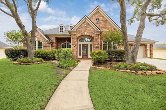 12210 Pebble Mdws, Houston, TX 77041 - traditional-style house with brick siding, driveway, and a front yard