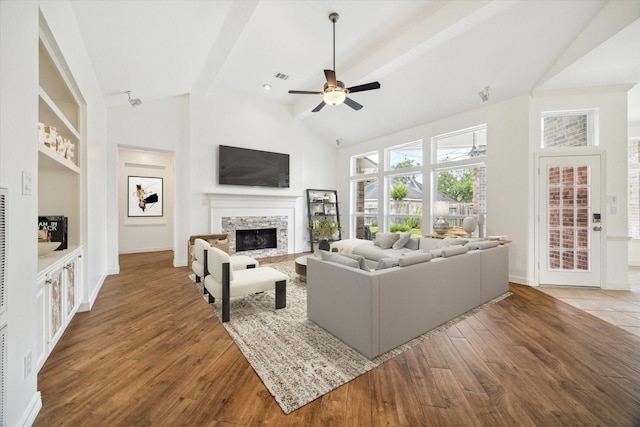 12210 Pebble Mdws, Houston, TX 77041 - living room with lofted ceiling, ceiling fan, a fireplace, wood finished floors, and baseboards