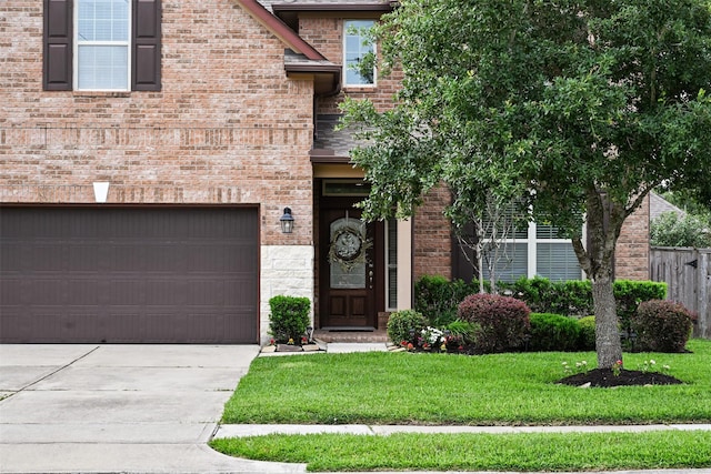 3413 Waverly Springs Ln, Pearland, TX 77581 - view of front of house with concrete driveway, brick siding, and a garage