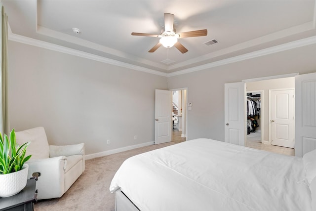 3413 Waverly Springs Ln, Pearland, TX 77581 - bedroom with a tray ceiling, light carpet, ornamental molding, baseboards, and ceiling fan