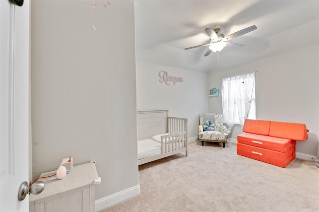 3413 Waverly Springs Ln, Pearland, TX 77581 - bedroom with a crib, carpet floors, baseboards, and a ceiling fan