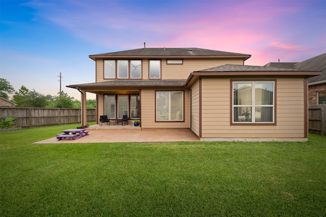 3413 Waverly Springs Ln, Pearland, TX 77581 - back of property at dusk featuring a patio area