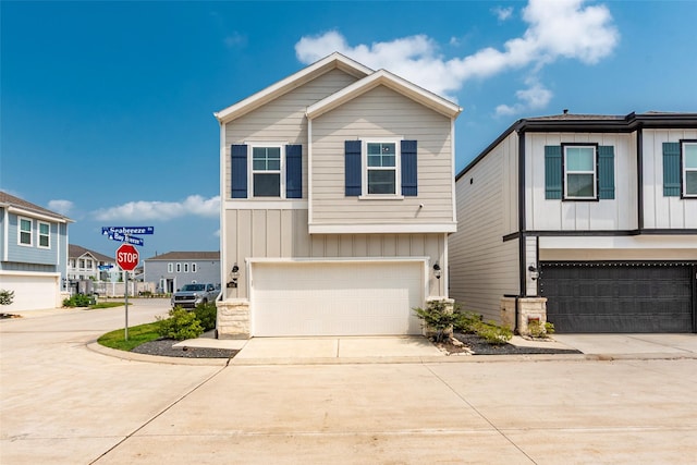 614 Seabreeze Dr, Kemah, TX 77565 - view of front of house featuring an attached garage, board and batten siding, and concrete driveway