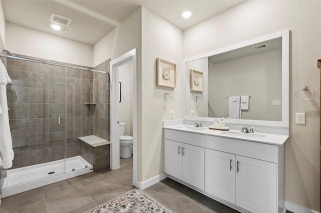 614 Seabreeze Dr, Kemah, TX 77565 - full bathroom with toilet, a stall shower, double vanity, and tile patterned floors