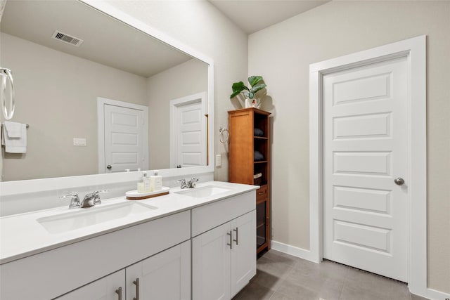 614 Seabreeze Dr, Kemah, TX 77565 - full bathroom featuring double vanity, tile patterned floors, and baseboards