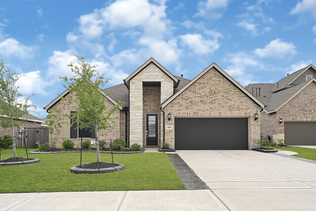 9506 Marble Park Ln, Baytown, TX 77521 - french provincial home featuring a garage, concrete driveway, brick siding, stone siding, and roof with shingles