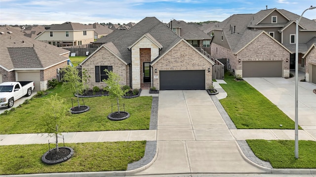 9506 Marble Park Ln, Baytown, TX 77521 - french provincial home featuring brick siding, a residential view, driveway, and an attached garage