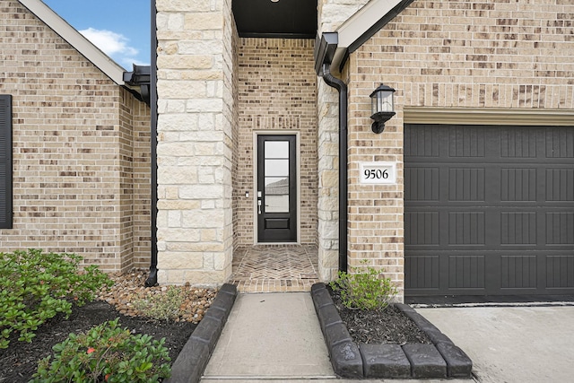 9506 Marble Park Ln, Baytown, TX 77521 - property entrance with brick siding and an attached garage
