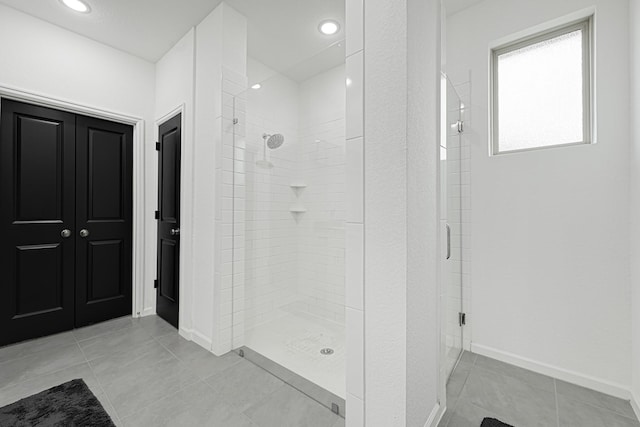 9506 Marble Park Ln, Baytown, TX 77521 - full bathroom featuring a stall shower, tile patterned flooring, baseboards, and recessed lighting