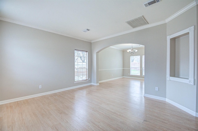 1811 Senca Springs Ct, Katy, TX 77450 - empty room with arched walkways, a chandelier, light wood-style flooring, crown molding, and baseboards