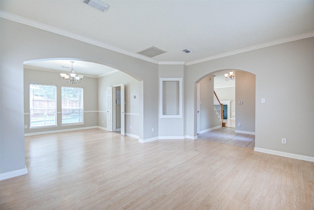 1811 Senca Springs Ct, Katy, TX 77450 - empty room with light wood finished floors, a chandelier, ornamental molding, baseboards, and stairway