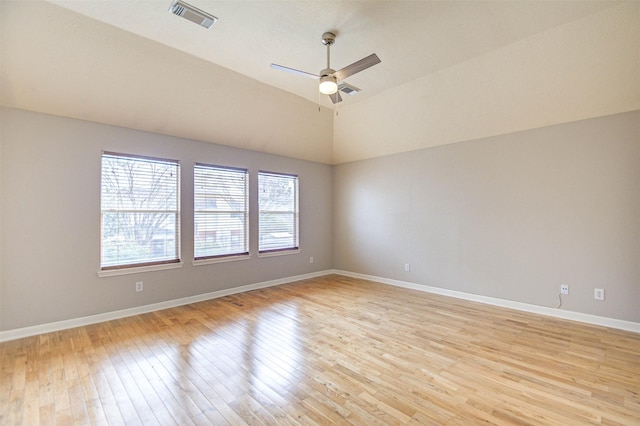1811 Senca Springs Ct, Katy, TX 77450 - empty room with light wood finished floors, ceiling fan, baseboards, and lofted ceiling