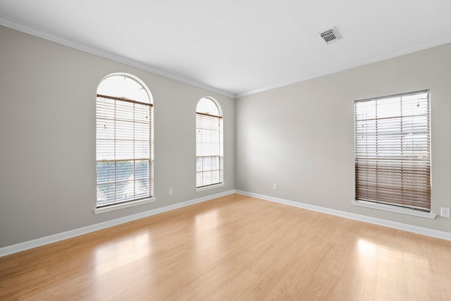 1811 Senca Springs Ct, Katy, TX 77450 - empty room with light wood-type flooring, ornamental molding, and baseboards