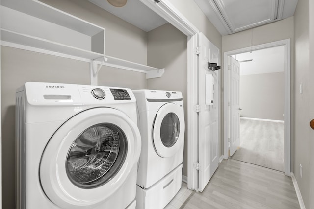 1811 Senca Springs Ct, Katy, TX 77450 - washroom with attic access, washer and dryer, light wood-type flooring, and baseboards