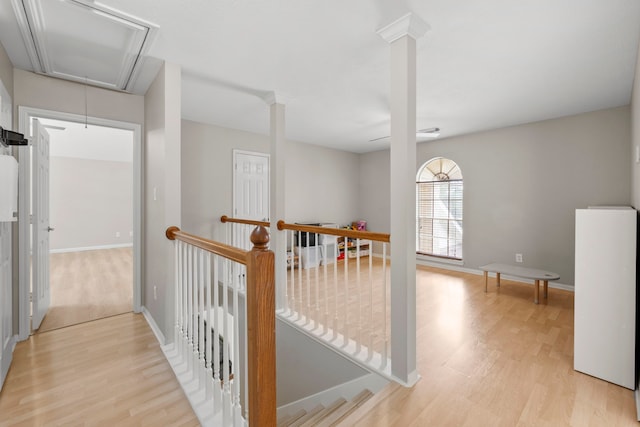 1811 Senca Springs Ct, Katy, TX 77450 - hallway with attic access, an upstairs landing, light wood-style flooring, and baseboards