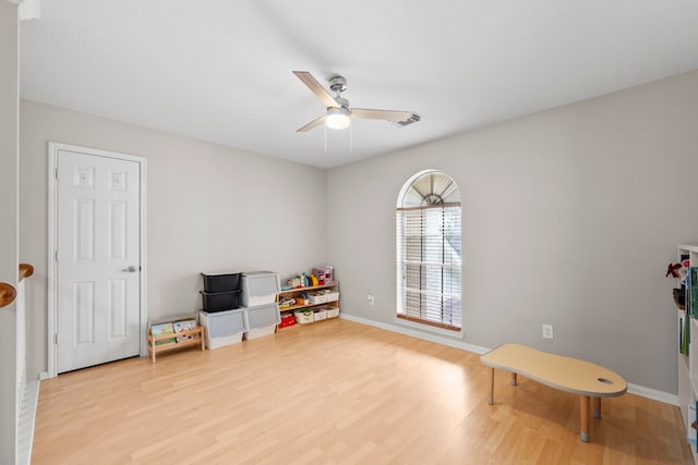 1811 Senca Springs Ct, Katy, TX 77450 - playroom featuring ceiling fan, light wood finished floors, and baseboards