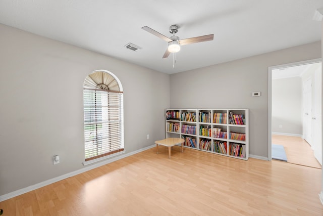 1811 Senca Springs Ct, Katy, TX 77450 - sitting room featuring wood finished floors, ceiling fan, and baseboards