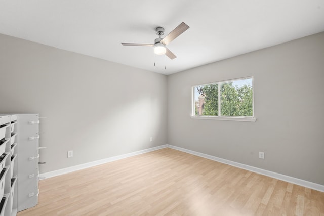 1811 Senca Springs Ct, Katy, TX 77450 - spare room featuring ceiling fan, light wood finished floors, and baseboards