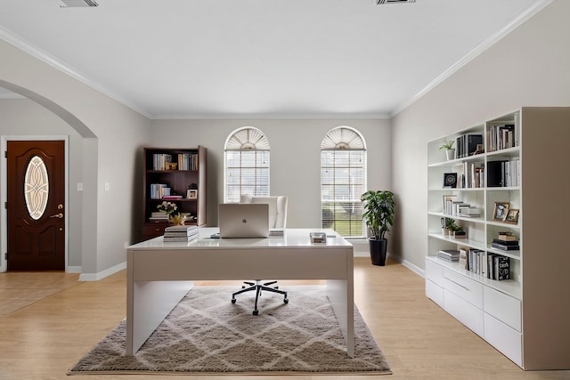 1811 Senca Springs Ct, Katy, TX 77450 - home office with arched walkways, crown molding, light wood-type flooring, and baseboards
