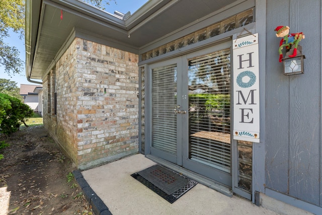 2413 38th Ave N, Texas City, TX 77590 - doorway to property featuring french doors and brick siding