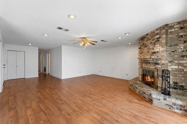 2413 38th Ave N, Texas City, TX 77590 - unfurnished living room with ceiling fan, a brick fireplace, wood finished floors, and recessed lighting