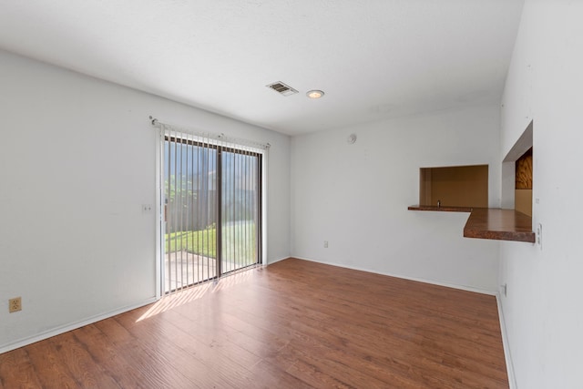 2413 38th Ave N, Texas City, TX 77590 - spare room with wood finished floors and baseboards