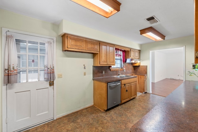 2413 38th Ave N, Texas City, TX 77590 - kitchen featuring stainless steel dishwasher, a sink, dark countertops, decorative backsplash, and under cabinet range hood