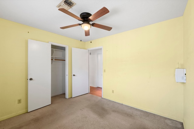 2413 38th Ave N, Texas City, TX 77590 - unfurnished bedroom featuring carpet floors, a closet, baseboards, and a ceiling fan